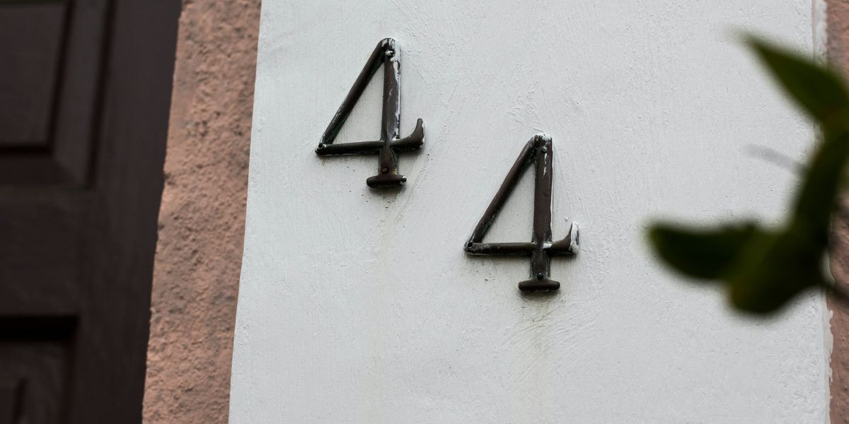 44 on white wall
