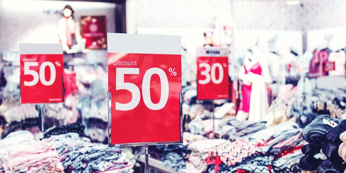 50% off sale signs at a clothing store