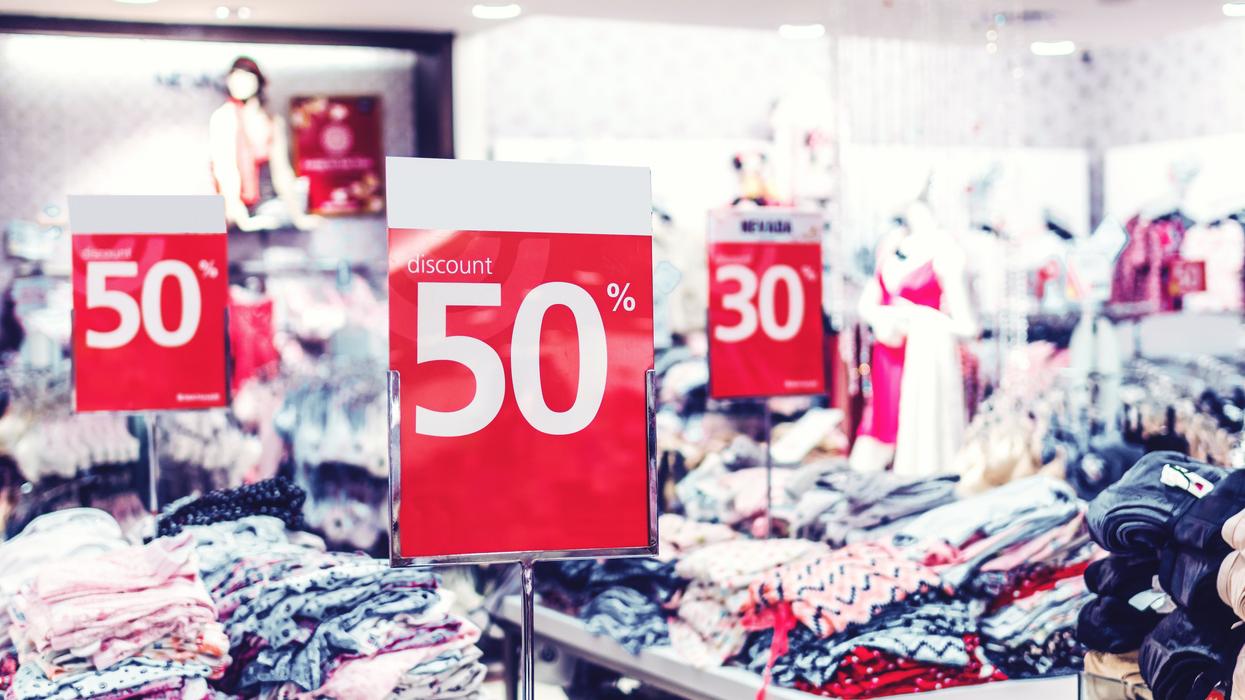 50% off sale signs at a clothing store