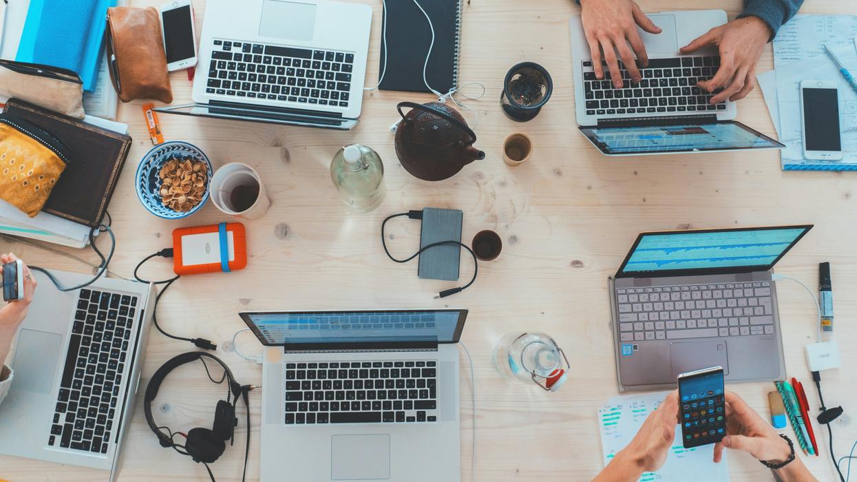 A collection of laptops around a table
