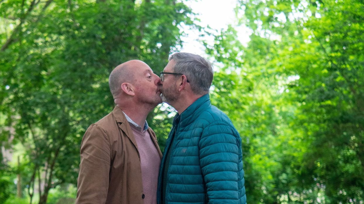 a couple kiss during a hike