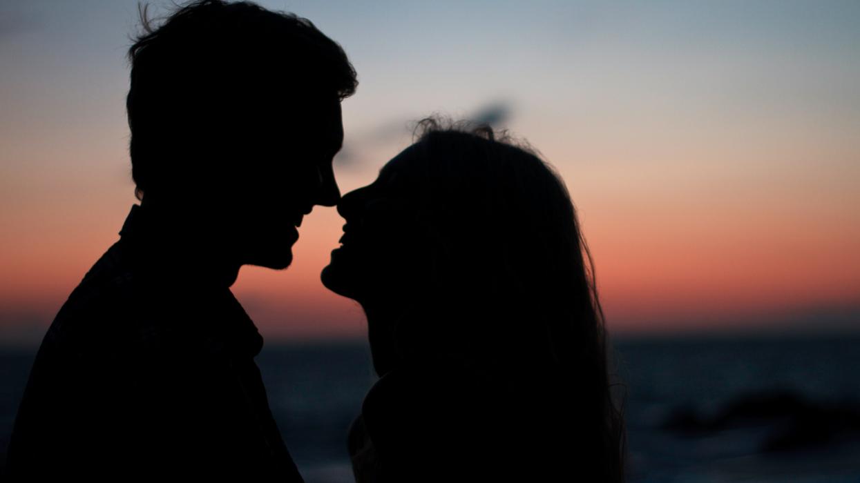 A couple kissing in silhouette