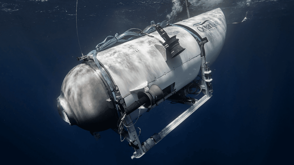A file photo from OceanGate depicts the Titan submersible descending in the ocean