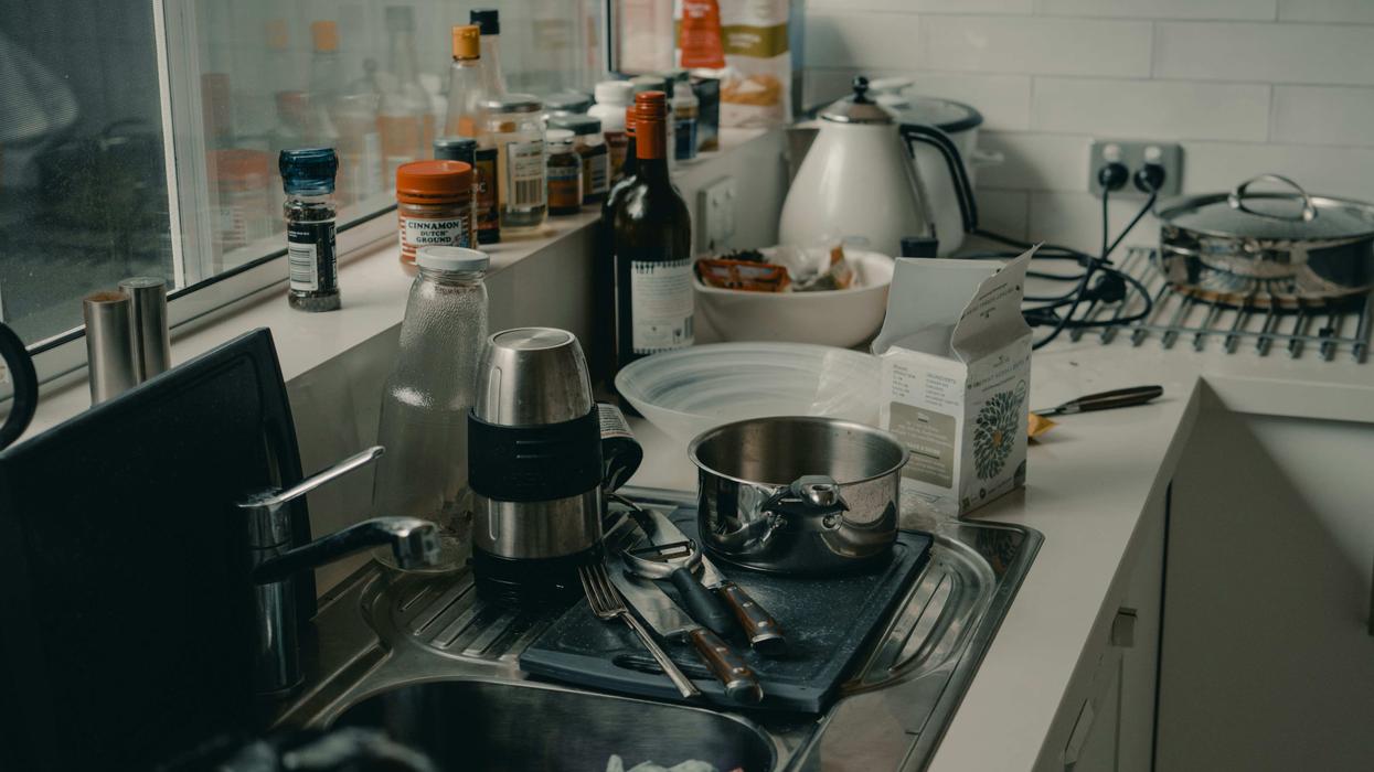 A kitchen counter with appliances all over it