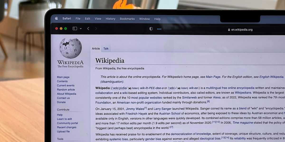 A laptop with a Wikipedia page on the screen