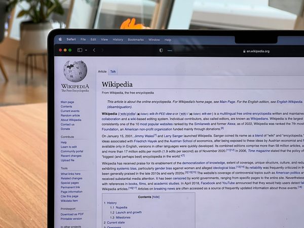 A laptop with a Wikipedia page on the screen