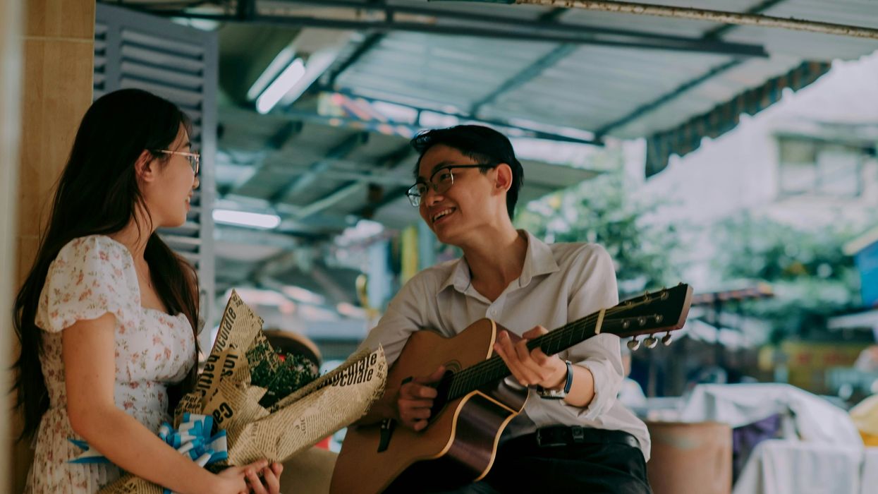 A man singing to a woman