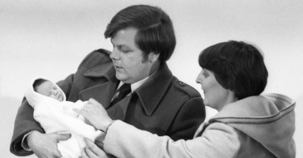 A newborn Elizabeth Carr with her parents