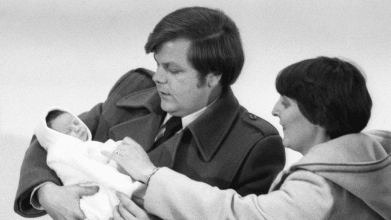 A newborn Elizabeth Carr with her parents