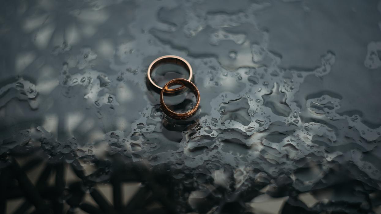 A pair of wedding rings on the ground