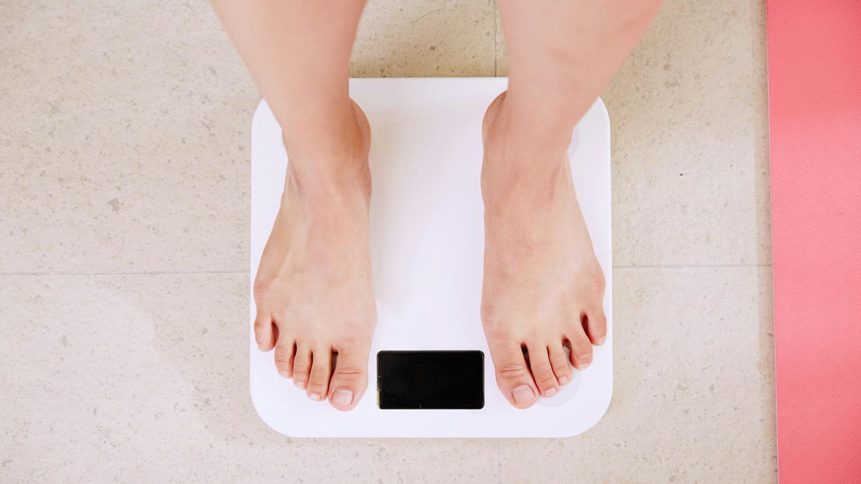 A person standing on a scale