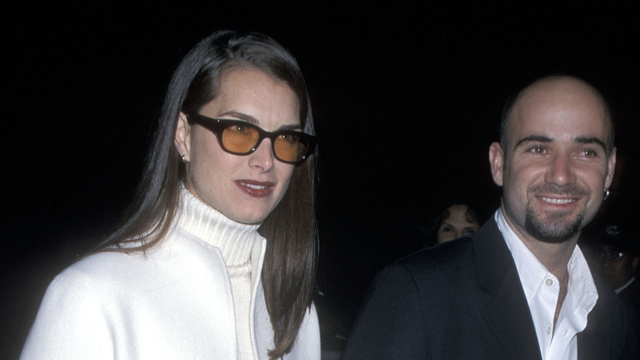 A photo of Actress Brooke Shields and tennis star Andre Agassi taken outdoors at night.