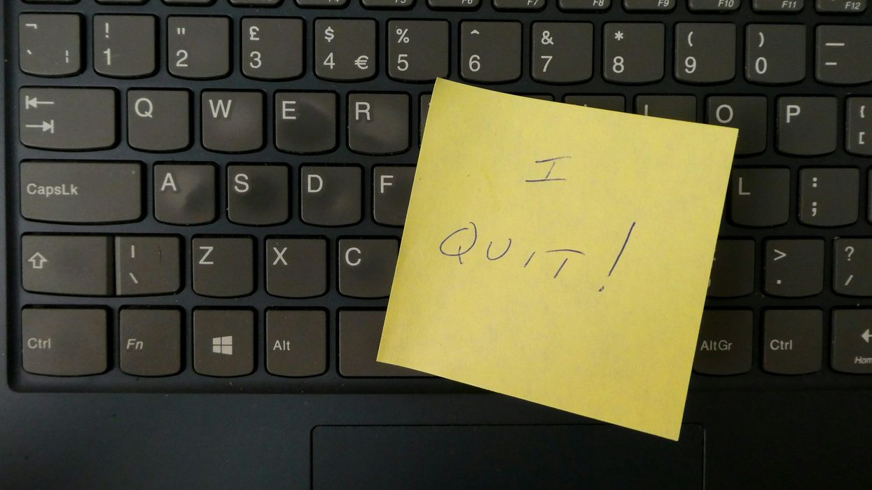 A post-it with "I Quit" written on it over a computer keypad