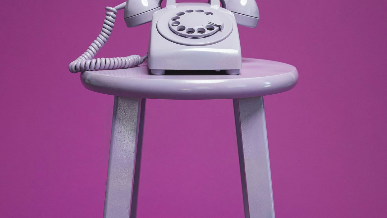 A purple rotary phone