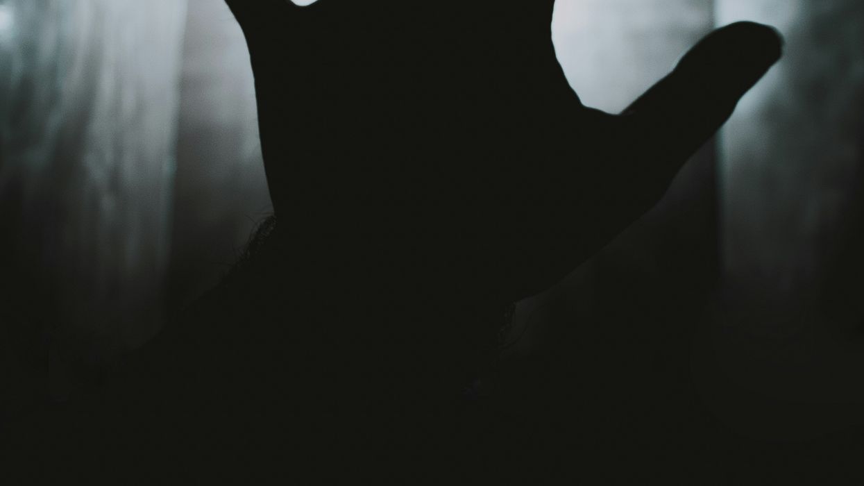 A silhouette of a hand.