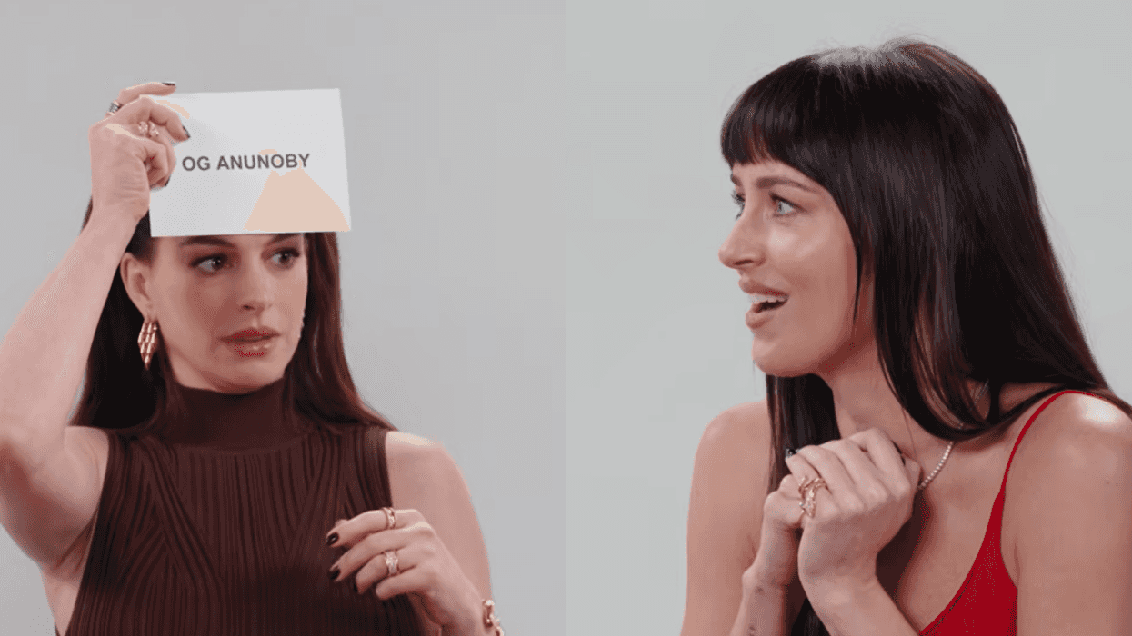 A split screen of Anne Hathaway holding a card with OG Anunoby's name on it to her forehead and Dakota Johnson looking on with a shocked expression on her face.