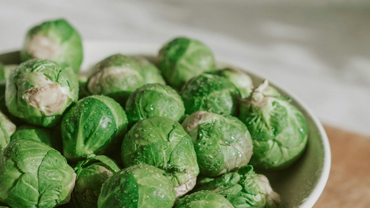 A white bowk full of brussell sprouts