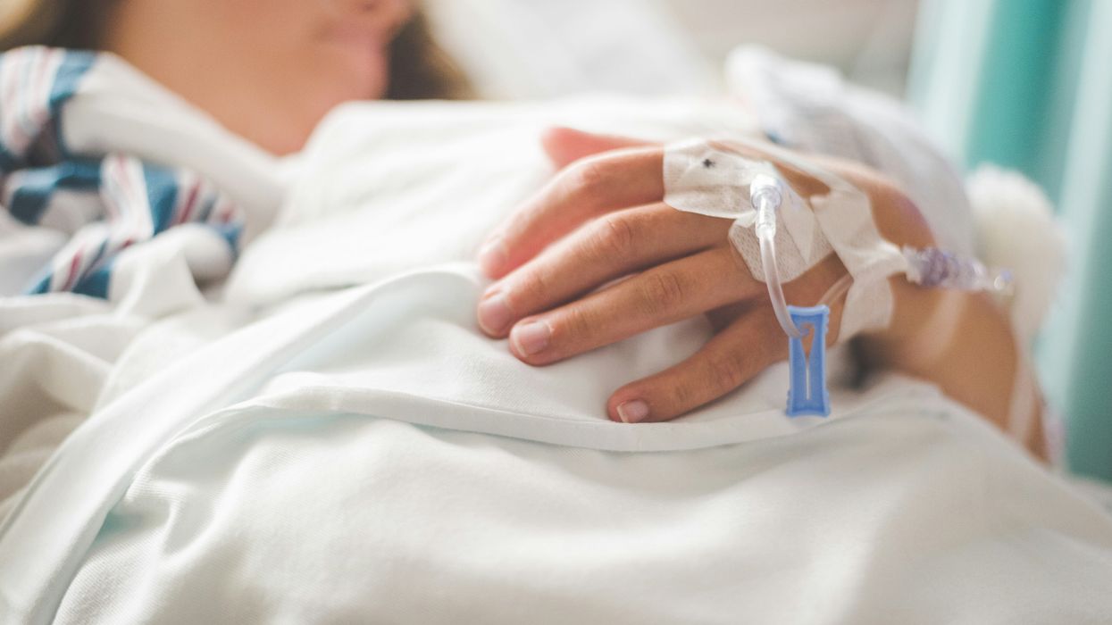 A woman in a hospital bed