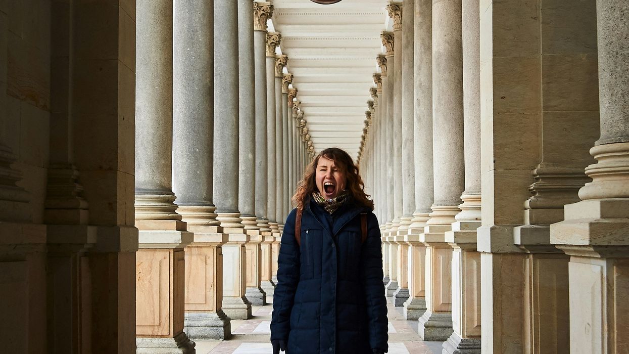 A woman screaming in a pathway