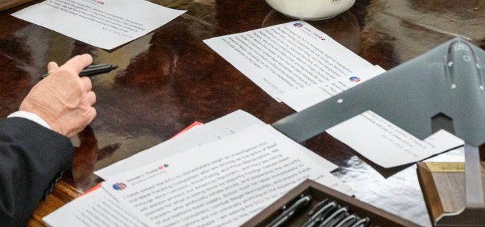A zoomed in shot of the papers on Donald Trump's desk