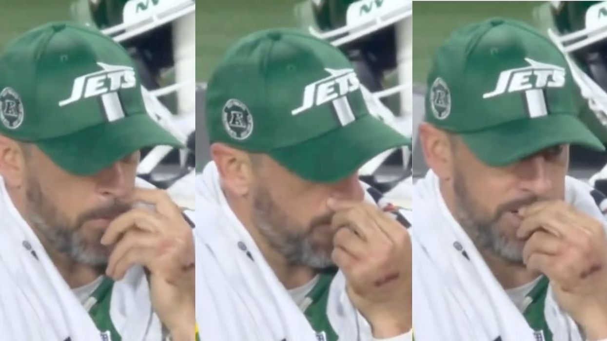 Aaron Rodgers appearing to pick his nose and eat it