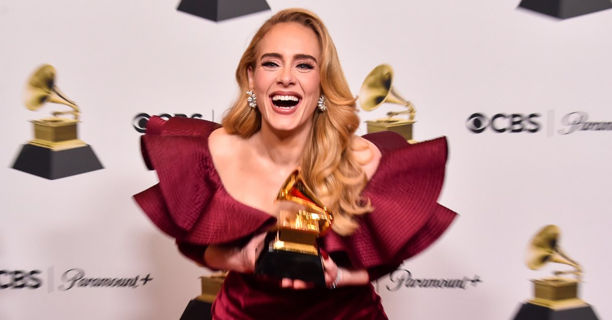 Adele holding a Grammy Award