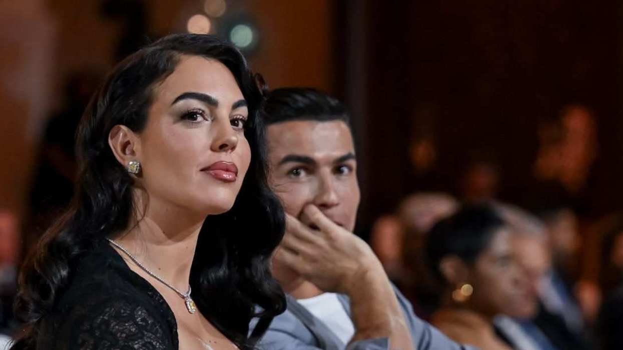 Al-Nassr player Cristiano Ronaldo (2nd L) and Georgina Rodriguez (L) attend the Globe Soccer Dubai Awards 2024.