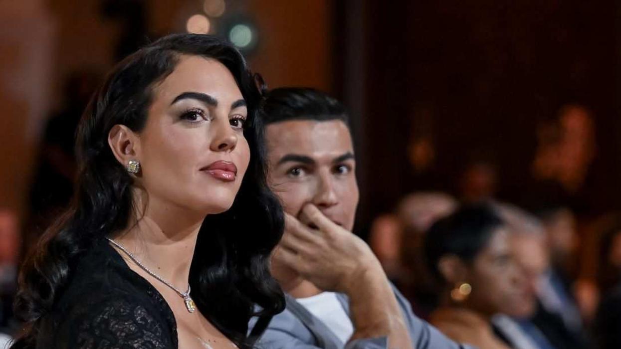 Al-Nassr player Cristiano Ronaldo (2nd L) and Georgina Rodriguez (L) attend the Globe Soccer Dubai Awards 2024.