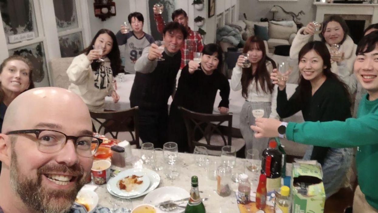 Alexander Campagna's Facebook photo with the stranded South Korean tourists in his home