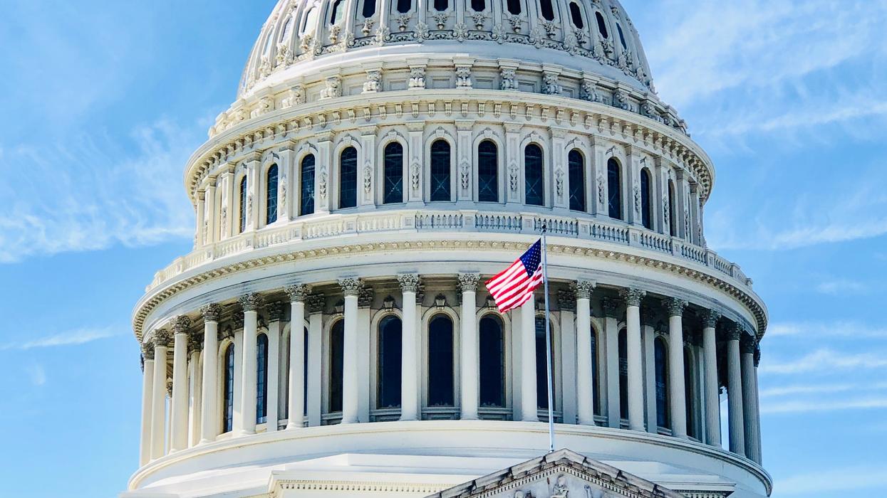 American flag in front of capital building