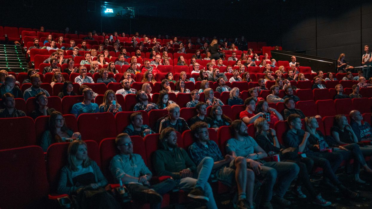 An audience in a movie theater watching a movie