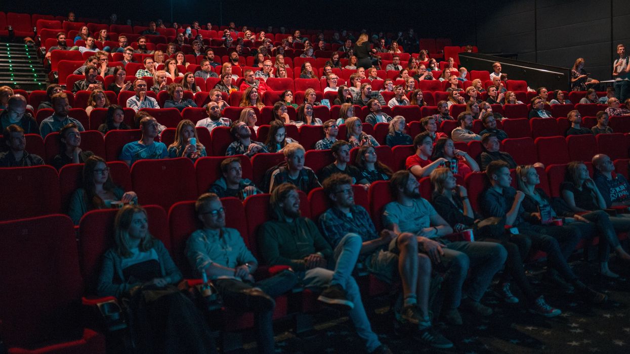 An audience watching a movie in a movie theatre