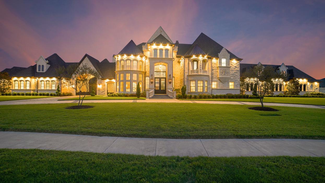 An illuminated mansion at night