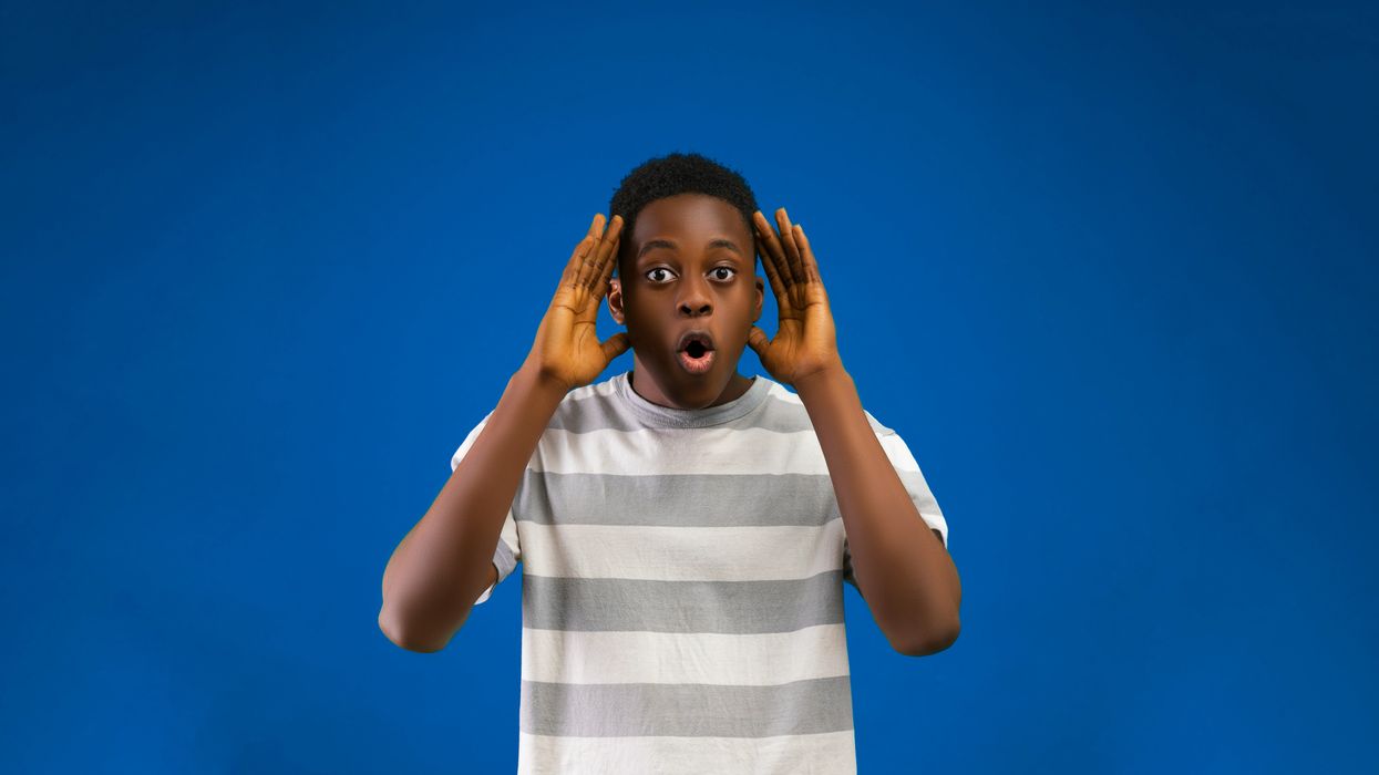 Appalled man holding up his hands