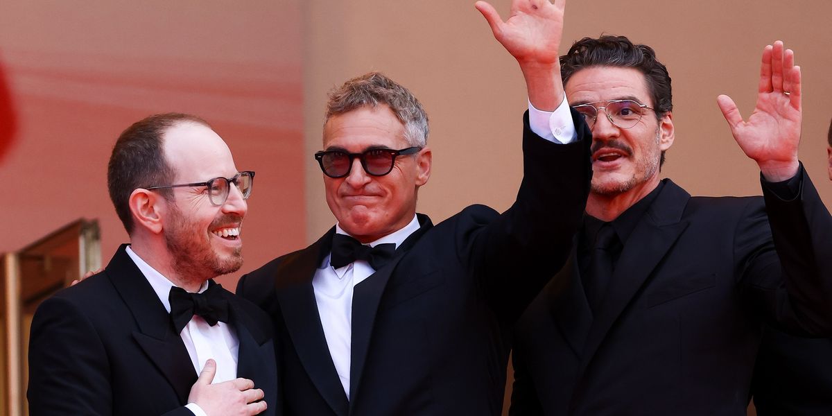 Pedro Pascal Yanked Joaquin Phoenix's Arm Down At Cannes—And Fans Sadly Think They Know Why