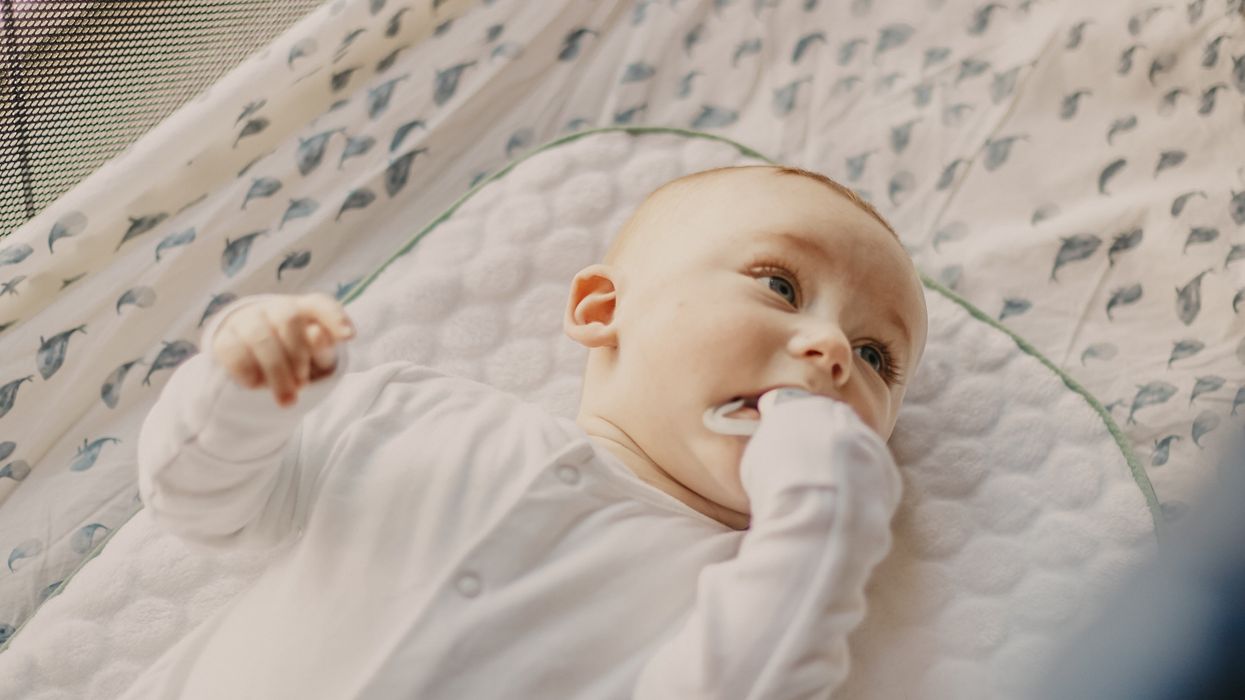 Baby on back in their crib