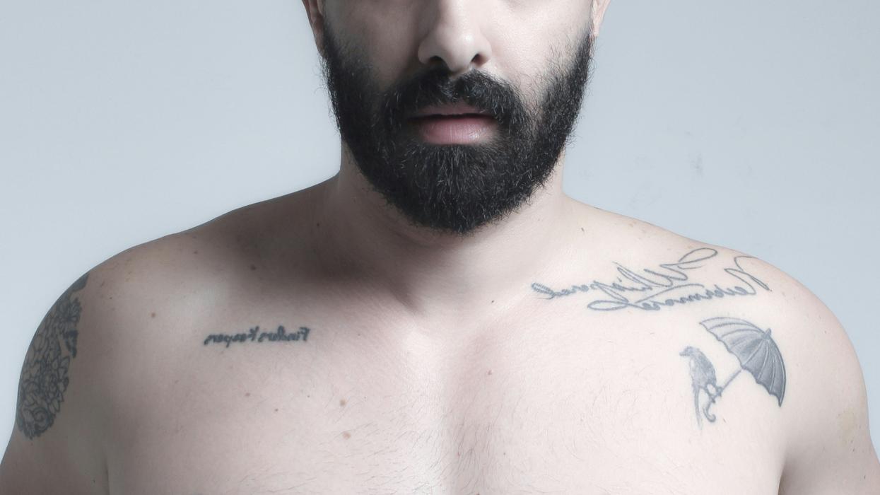 bearded man's nude torso