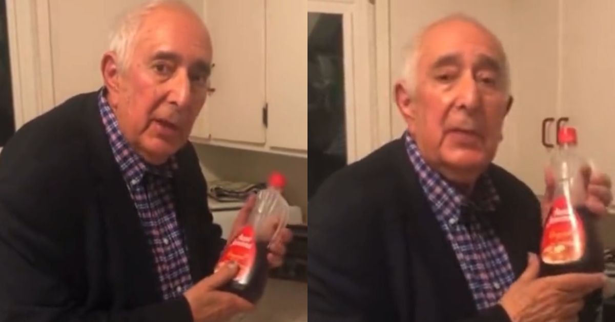 Ben Stein holding a syrup bottle