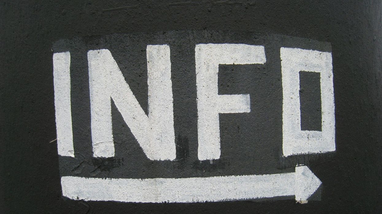 Black and white photo saying the abbreviation "info" in caps, with an arrow pointing to the left underneath