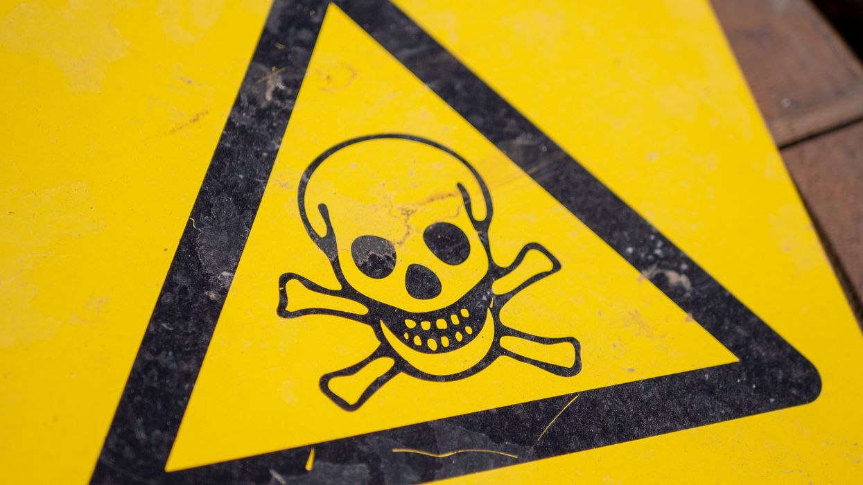 black and yellow poison sign