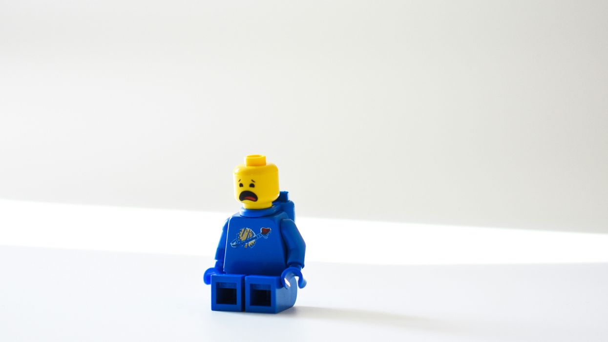 blue lego minifig on white surface