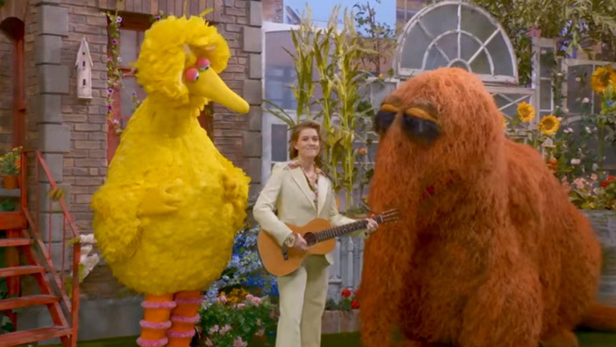 Brandi Carlile performing with Big Bird and Snuffleupagus