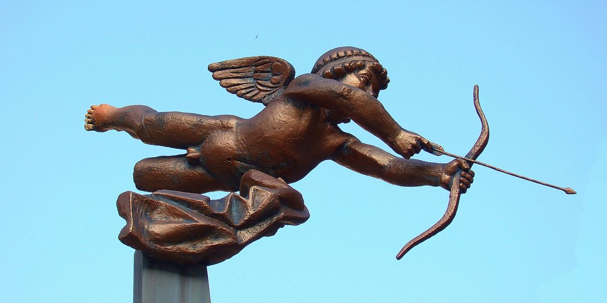 Bronze statue of Cupid pointing his arrow