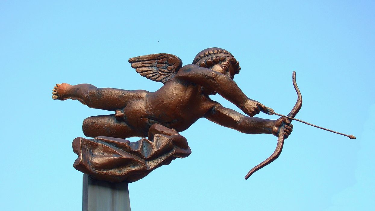 Bronze statue of Cupid pointing his arrow