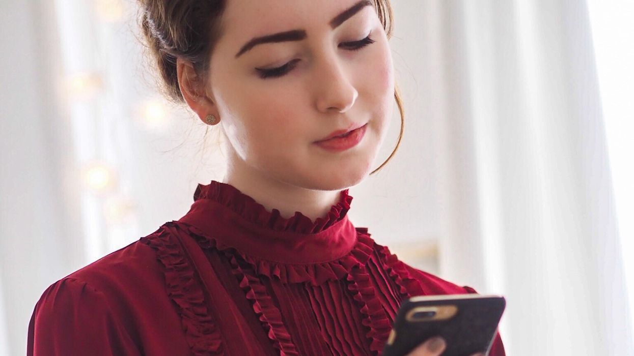 Businesswoman looking at cell phone