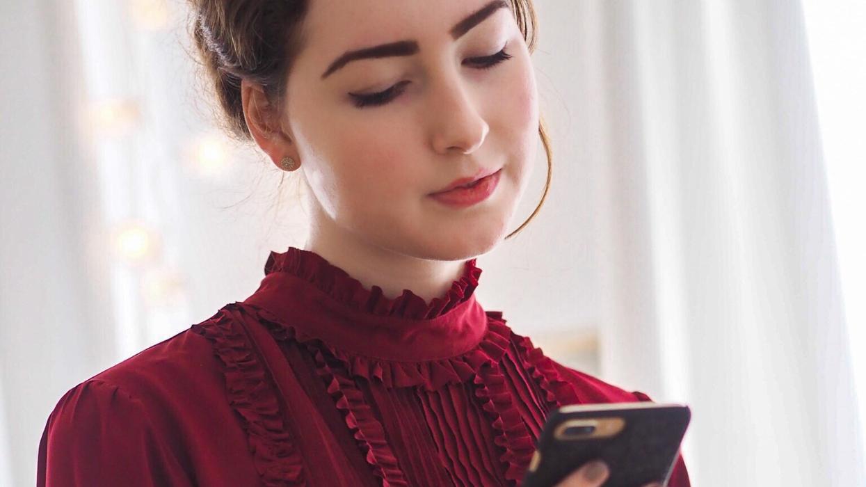 Businesswoman looking at cell phone