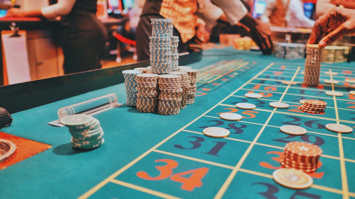Casino table with large stacks of gambling chips