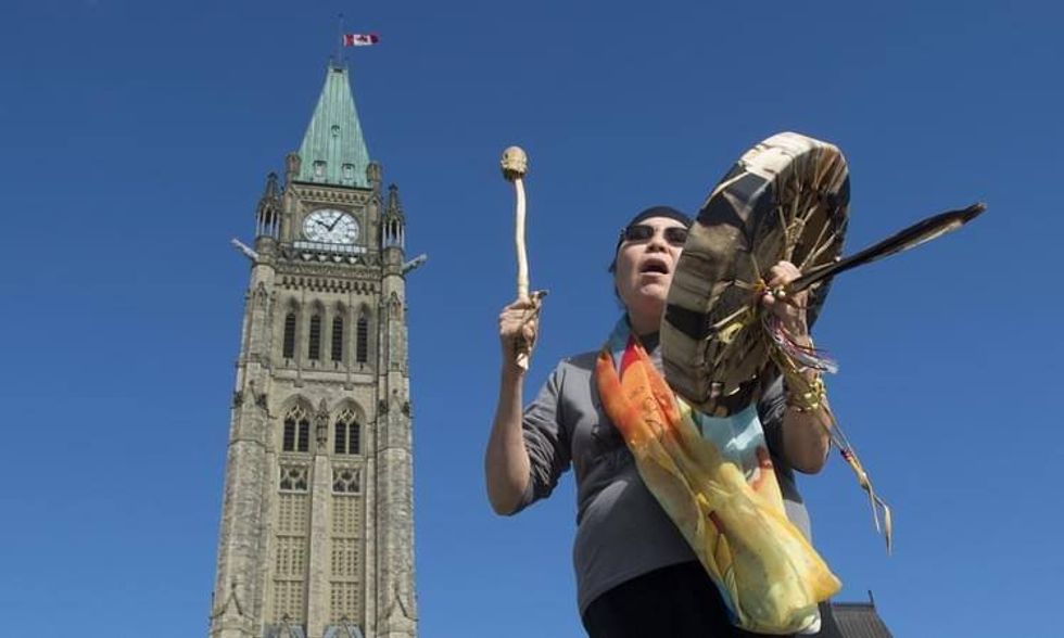 Chief Marcia Brown Martel, the lead plaintiff in an Ontario class action lawsuit related to the Sixties Scoop, drums out of Centre Block on Parliament Hill.