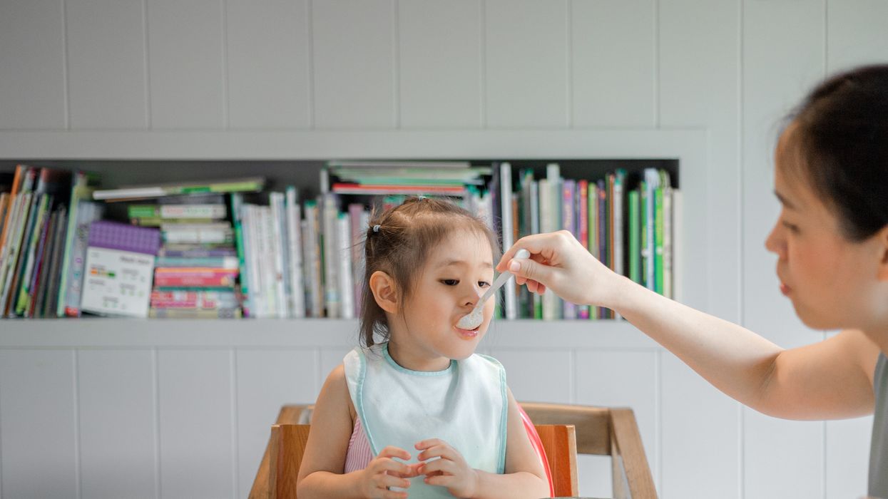 child being fed