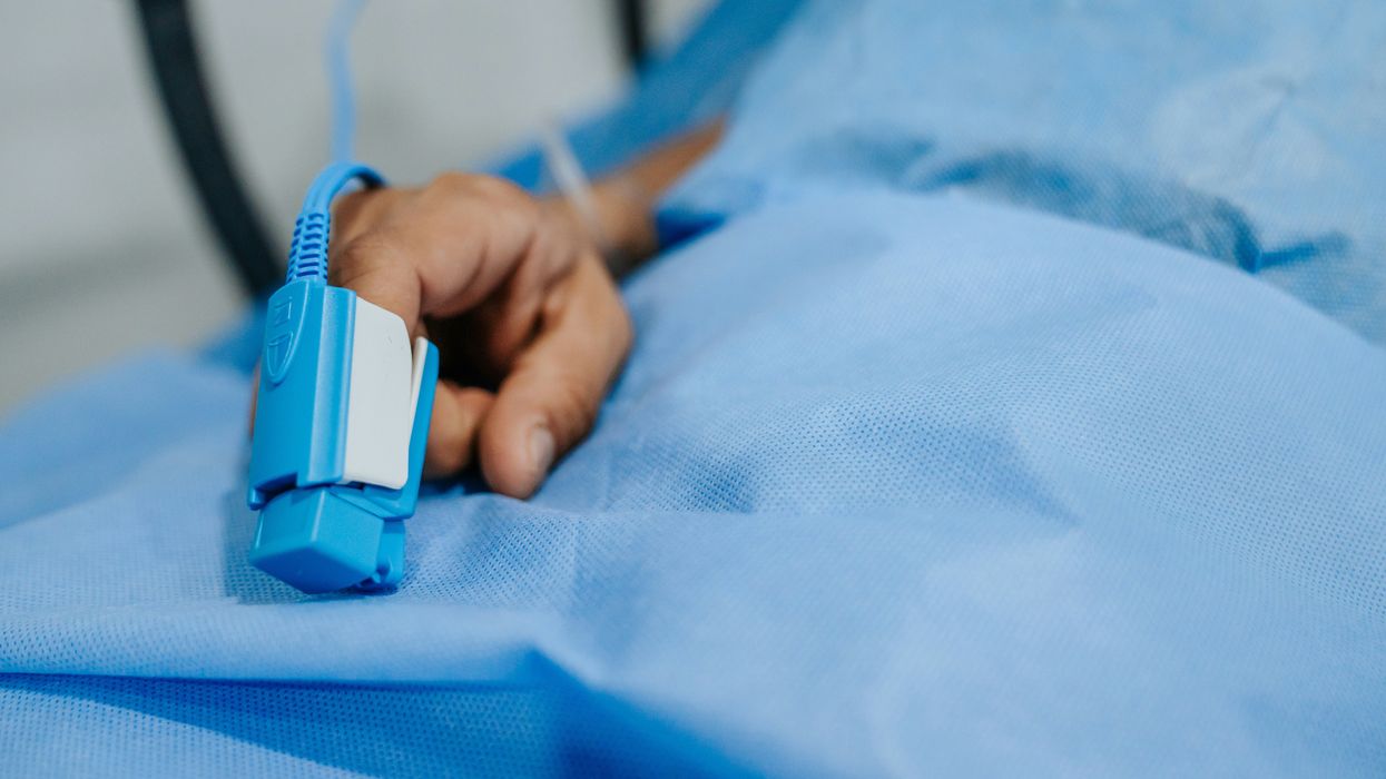 Close up of a patient wearing a pulse oximeter
